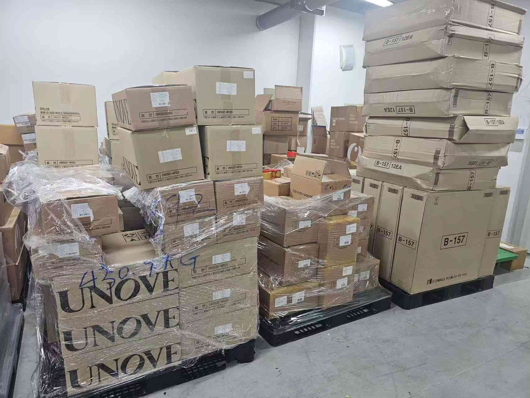 Shrink-wrapped pallets of UNOVE and Haruharu Wonder cartons