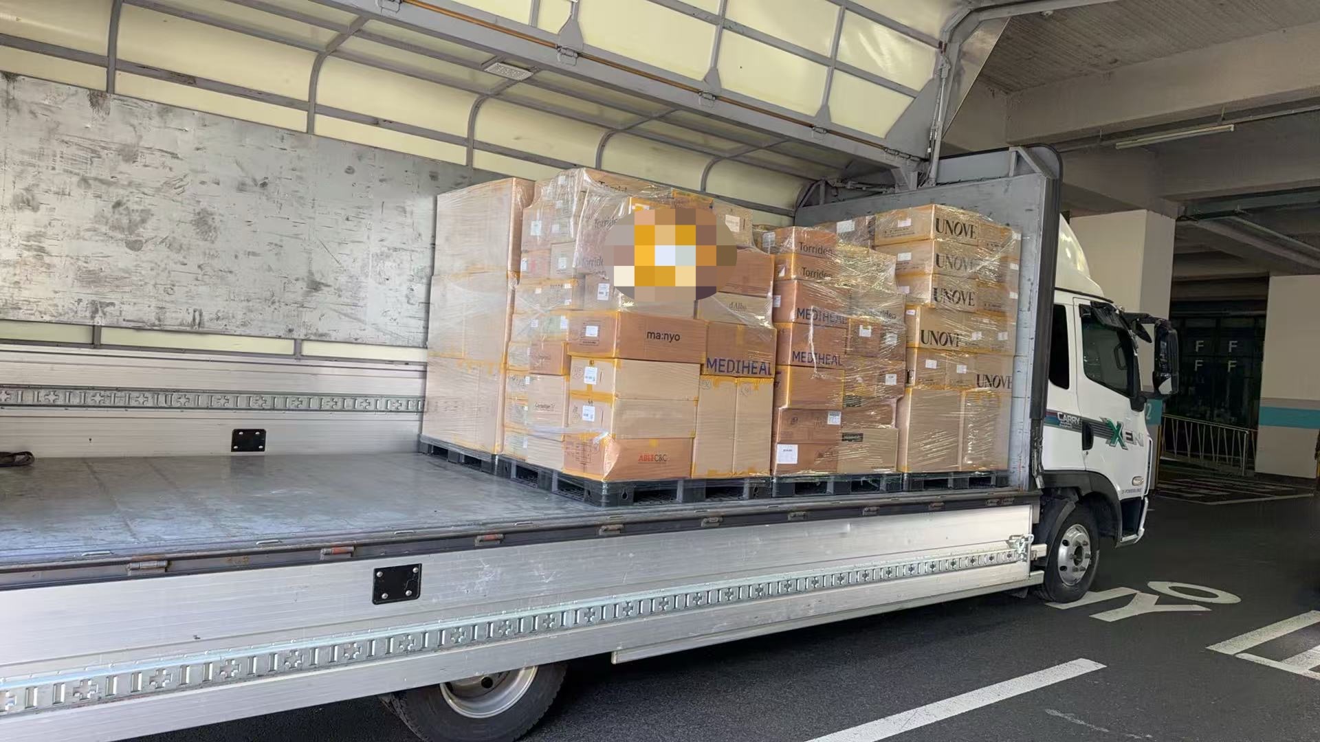 Full pallets loaded into a truck for export shipment
